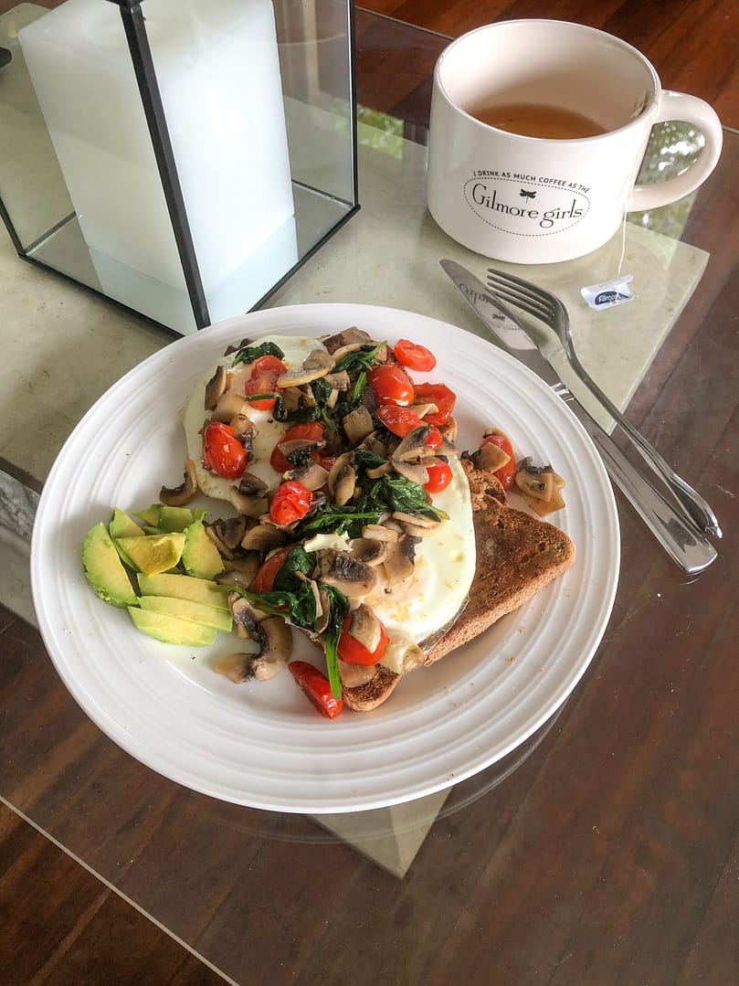 Fried eggs on Toast with mushrooms, spinach, capsicum and avocado